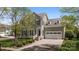 Charming two-story home with a well-manicured lawn, beautiful shrubbery, white trimmed windows, and a two-car garage at 801 Celbridge Ct, Charlotte, NC 28270