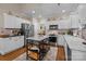 Bright kitchen featuring an island, stainless steel appliances, and ample cabinet space at 801 Celbridge Ct, Charlotte, NC 28270