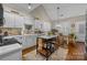 Open kitchen with an island, stainless steel appliances, and a breakfast nook with lots of natural light at 801 Celbridge Ct, Charlotte, NC 28270