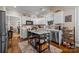 Well-lit kitchen featuring white cabinetry, stainless appliances, and a stylish center island with marble countertop at 801 Celbridge Ct, Charlotte, NC 28270