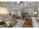 Inviting living room features hardwood floors, a fireplace, and neutral decor at 801 Celbridge Ct, Charlotte, NC 28270