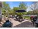 Charming patio with brick pavers, outdoor seating, and a barbecue grill, perfect for entertaining at 801 Celbridge Ct, Charlotte, NC 28270