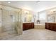 Large bathroom with a glass shower, soaking tub, double vanities, and tiled flooring at 8618 Whitehawk Hill Rd, Waxhaw, NC 28173