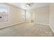 Spacious bedroom with neutral walls and carpet, featuring ample natural light from two windows at 8618 Whitehawk Hill Rd, Waxhaw, NC 28173