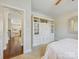 Bedroom with built-in cabinetry and an open view to the kitchen and entry, promoting an airy feel at 8618 Whitehawk Hill Rd, Waxhaw, NC 28173