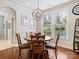 Charming breakfast nook features a round table, wood chairs, natural light, and views of the outdoors at 8618 Whitehawk Hill Rd, Waxhaw, NC 28173
