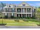 Stunning two-story brick home featuring a charming double porch and well-manicured lawn at 8618 Whitehawk Hill Rd, Waxhaw, NC 28173