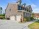 Three-car garage brick home with ample parking and beautiful landscaping at 8618 Whitehawk Hill Rd, Waxhaw, NC 28173