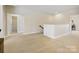 Neutral hallway leading to various rooms, showcasing open floor plan, and carpet flooring at 8618 Whitehawk Hill Rd, Waxhaw, NC 28173
