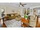Spacious living room with hardwood floors, neutral paint, and a view of the staircase at 8618 Whitehawk Hill Rd, Waxhaw, NC 28173