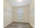 Walk-in closet features vinyl floor, a window, and wire shelves for maximum storage and organization at 8618 Whitehawk Hill Rd, Waxhaw, NC 28173