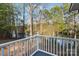 Scenic view from the backyard deck featuring lush trees and a lake in the distance at 902 Cornelius Rd, Mooresville, NC 28117