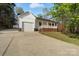 Ranch style home with attached garage and a long driveway at 902 Cornelius Rd, Mooresville, NC 28117