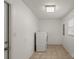 Bright laundry room with tile flooring, washer, and dryer hookups at 902 Cornelius Rd, Mooresville, NC 28117