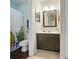 Bathroom features decorative shower curtain, updated vanity and wood-look flooring at 9036 Four Mile Creek Rd, Charlotte, NC 28277