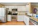 Bright kitchen with stainless steel appliances, granite countertops, and ample cabinet space at 9036 Four Mile Creek Rd, Charlotte, NC 28277