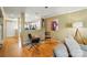 Cozy living room with hardwood floors open to kitchen; neutral paint at 9036 Four Mile Creek Rd, Charlotte, NC 28277