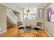 Living area featuring beautiful floors, stairway and views into the kitchen at 9036 Four Mile Creek Rd, Charlotte, NC 28277