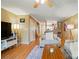 Open-concept living room featuring hardwood floors, comfortable seating, and natural light at 9036 Four Mile Creek Rd, Charlotte, NC 28277