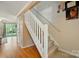 Bright entryway with a staircase and hardwood floors, leading to the upper level at 9036 Four Mile Creek Rd, Charlotte, NC 28277