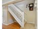 Interior shot showcasing staircase featuring carpeted stairs and a white railing at 9036 Four Mile Creek Rd, Charlotte, NC 28277