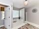 Bright bathroom with a soaking tub, separate shower, and a decorative wall hanging at 9427 Bethesda Ct, Matthews, NC 28104