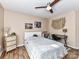 Comfortable bedroom with ceiling fan, hardwood floors, and ample natural light at 9427 Bethesda Ct, Matthews, NC 28104