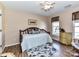 Cozy bedroom with hardwood floors, area rug and nice natural light through the window at 9427 Bethesda Ct, Matthews, NC 28104