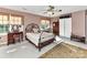Comfortable bedroom with sunlight streaming in, plus a decorative wrought iron bed frame at 9427 Bethesda Ct, Matthews, NC 28104