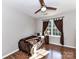 Cozy bedroom features hardwood floors and natural light from the large window at 9427 Bethesda Ct, Matthews, NC 28104