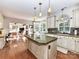 Open kitchen with a view to the living area, featuring an island and modern appliances at 9427 Bethesda Ct, Matthews, NC 28104