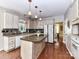 Well-appointed kitchen with an island, updated appliances, and ample cabinet space at 9427 Bethesda Ct, Matthews, NC 28104