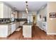 Spacious kitchen with granite countertops, stainless steel appliances, and center island at 9427 Bethesda Ct, Matthews, NC 28104