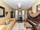 Comfortable living room with a classic piano, plush sofa, and stylish furnishings at 9427 Bethesda Ct, Matthews, NC 28104