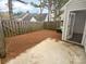 A cozy fenced backyard features a concrete patio, perfect for outdoor dining and relaxing at 9930 Birch Knoll Ct, Charlotte, NC 28213