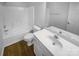 Bathroom features a vanity with modern fixtures, toilet, and tub with shower at 9930 Birch Knoll Ct, Charlotte, NC 28213