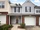 Charming townhome featuring a brick facade, attached garage, and inviting entrance at 9930 Birch Knoll Ct, Charlotte, NC 28213