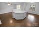 Kitchen island features white cabinets and countertop, offering ample space at 9930 Birch Knoll Ct, Charlotte, NC 28213