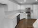 The kitchen is well-lit with ample storage, modern appliances, and sleek countertops, ready for cooking at 9930 Birch Knoll Ct, Charlotte, NC 28213