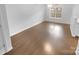 A bright and airy living room with sleek hardwood floors, showcasing a modern design and neutral color palette at 9930 Birch Knoll Ct, Charlotte, NC 28213