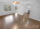 Bright living room boasts hardwood floors and plenty of natural light at 9930 Birch Knoll Ct, Charlotte, NC 28213