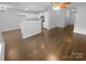 Open-concept living area with sleek hardwood floors and abundant natural light, ideal for modern living at 9930 Birch Knoll Ct, Charlotte, NC 28213