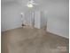 Spacious primary bedroom with neutral carpet and ensuite bathroom access at 9930 Birch Knoll Ct, Charlotte, NC 28213