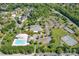 Aerial view of the community amenities including a pool, clubhouse, parking, and tennis courts at 104 Hallmark Xing, Rock Hill, SC 29732