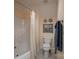 Bright bathroom featuring a white bathtub and shower with a shower curtain, toilet, and decorative wall art at 104 Hallmark Xing, Rock Hill, SC 29732