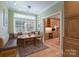 Inviting breakfast nook with large window, built in bench, and hardwood floors at 104 Hallmark Xing, Rock Hill, SC 29732