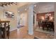 Light-filled dining room with hardwood floors, elegant chandelier, and columns at 104 Hallmark Xing, Rock Hill, SC 29732