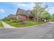 Inviting brick home with manicured lawn and professional landscaping along front corner at 104 Hallmark Xing, Rock Hill, SC 29732