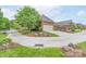 Home with a well-maintained lawn, landscaped garden beds with decorative rocks, and a brick exterior at 104 Hallmark Xing, Rock Hill, SC 29732