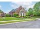 Charming brick home featuring professionally landscaped yard with mature shrubbery at 104 Hallmark Xing, Rock Hill, SC 29732
